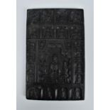 A Chinese carved spinach jade tablet of Buddha, sat in a lotus position surrounded with his