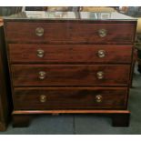 A Georgian straight fronted chest of drawers with string inlay, four graduated drawers with twin