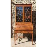 An Edwardian string inlaid mahogany veneer bureau bookcase by Maple & Co, the glazed astragal