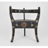A Norwegian folk art painted and stained wooden chair with horse shoe back, on three legs,