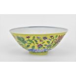 A Chinese Famille Jaune porcelain bowl, with applied polychrome enamel chrysanthemums and other