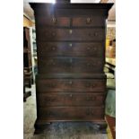 A late Georgian mahogany chest on chest, with moulded dentil cornice above a carved fretwork frieze,