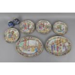 A set of four 19th century Cantonese porcelain plates and two oval dishes, each decorated with a