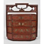 A Japanese Meiji period red lacquer sage jubako (picnic basket) with three octagonal shaped stacking