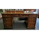 A Victorian mahogany twin pedestal desk, with tooled leather top above three frieze drawers and