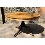 A Regency brass inlaid tilt top breakfast table, the circular top with rosewood banding and brass