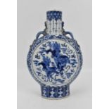 A late Qing dynasty blue and white porcelain moon flask vase, with central panels either side
