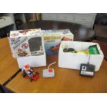 A 1993 Nikko Super Mario Kart radio controlled car with Mario together with a Nikko 1/16 scale radio