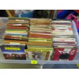 A collection of vinyl records singles, 45's, to include the Beatles, Rolling Stones, James Brown,