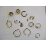 A lot of 9ct gold to include three rings, earrings, pendants, some unmarked but tests for 9ct, 12g