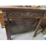 A carved mahogany fire surround 119cm h x 126cm w x 16.5cm Location: G