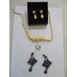 A 9ct gold necklace together with an ivory necklace and two pairs of earrings Location: cab