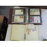 An album of First Day covers and an album of stamps from various countries Location: 9:6