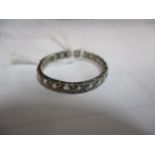 A 19th Century white metal and white sapphire full eternity ring, re-sized, A/F, UK ring size M