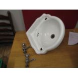 A Noveus Victorian white glazed corner sink and taps