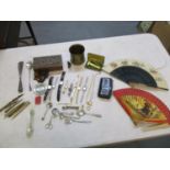 A mixed lot to include a silver pickle fork, eight wristwatches, brass trench art, Chinese copper