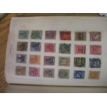 Four albums of postage stamps from around the world to include one album containing mainly