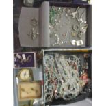 A selection of costume jewellery to include silver brooches, beaded necklaces, a compass and other