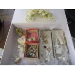 A collection of 20th century cake decorations A/F together with a vintage wedding tiara, housed in a