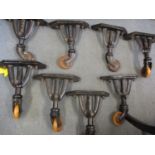 A set of eight early 20th wrought iron Vono bed trolley legs