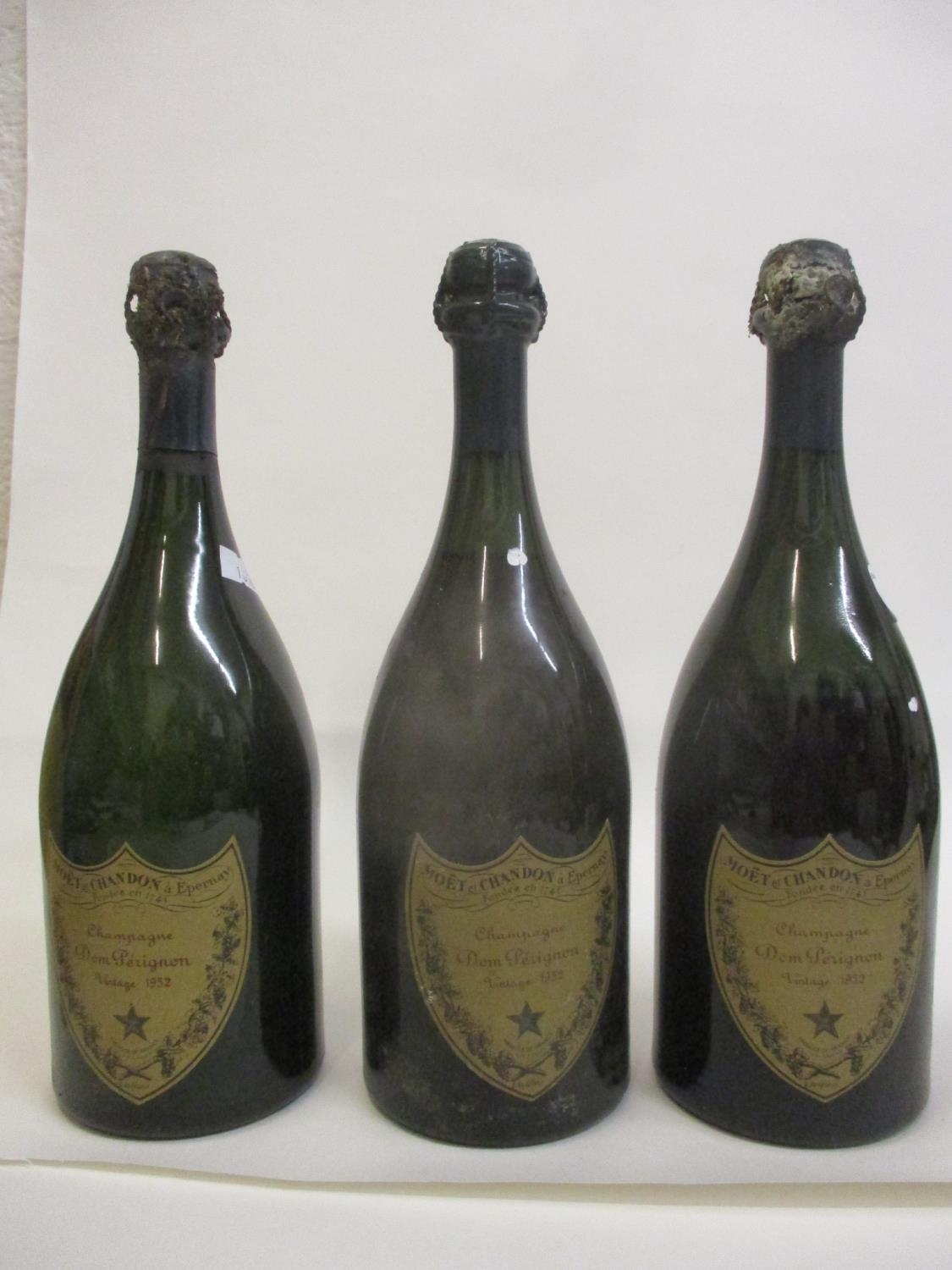 Three bottles of Moet & Chandon Dom Perignon vintage 1952 A/F Levels marked in white, one bottle