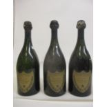 Three bottles of Moet & Chandon Dom Perignon vintage 1952 A/F Levels marked in white, one bottle