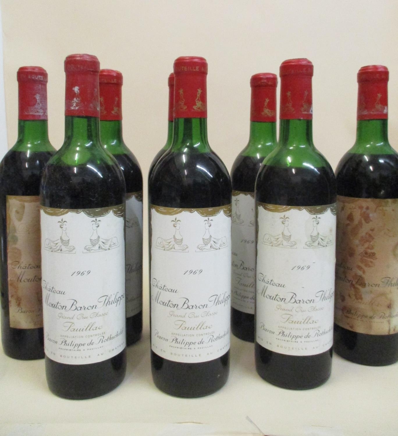 Eight bottles of Chateau Mouton Baron Philippe Grand Cru Classe Pauillac 1969 (two stained labels)