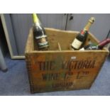 A wooden wine crate and three bottles to include half bottle of Moet & Chandon Champagne