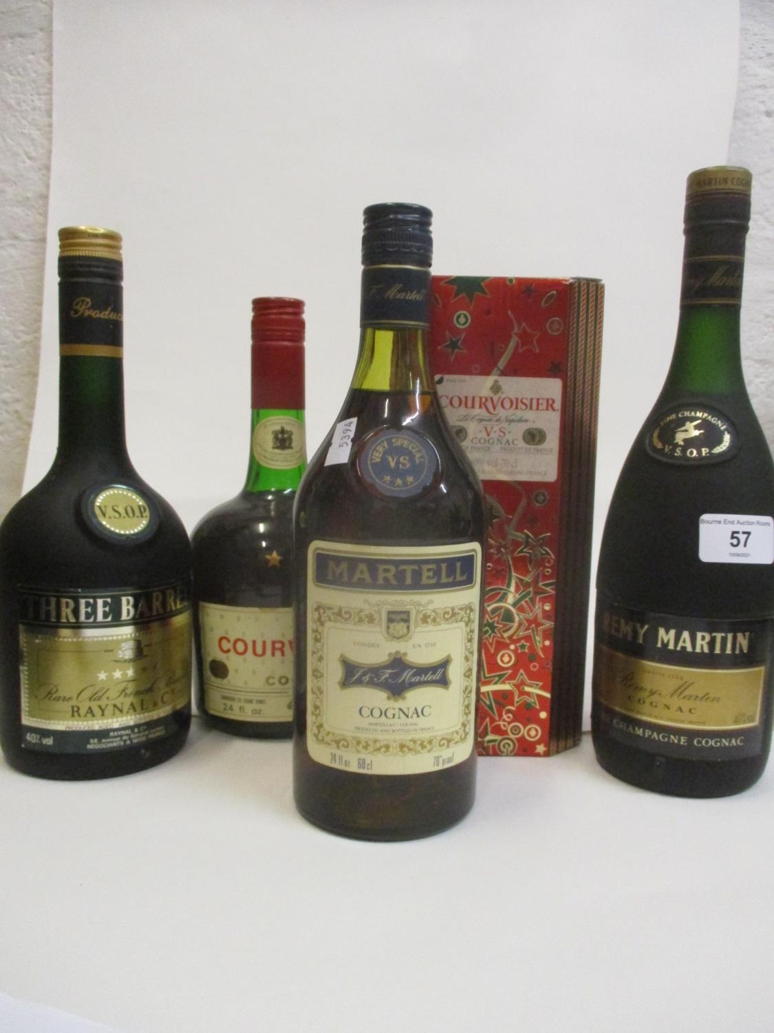 Four bottles of Cognac to include Courvoisier, Martel, Remy Martin and one bottle of Three Barrels