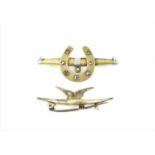 An 18ct yellow gold and diamond brooch with central gold horseshoe set with seven old cut