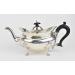 An Edwardian silver teapot by the Goldsmiths and Silversmiths Company, London 1902, with oblong body