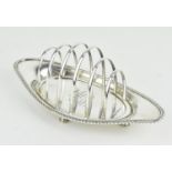 A Victorian silver toast rack by Atkin Brothers, Sheffield 1897, with gadrooned lip and graduated