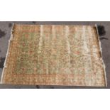 A hand woven silk Persian Nain rug, with light green ground designed with Shah Abbas floral