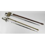 Two British army dress swords, one with leather scabbard, the grip with shagreen and large hoop