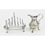 A George V silver toast rack by Charles & Richard Comyns, London 1925, of graduated shaped form with