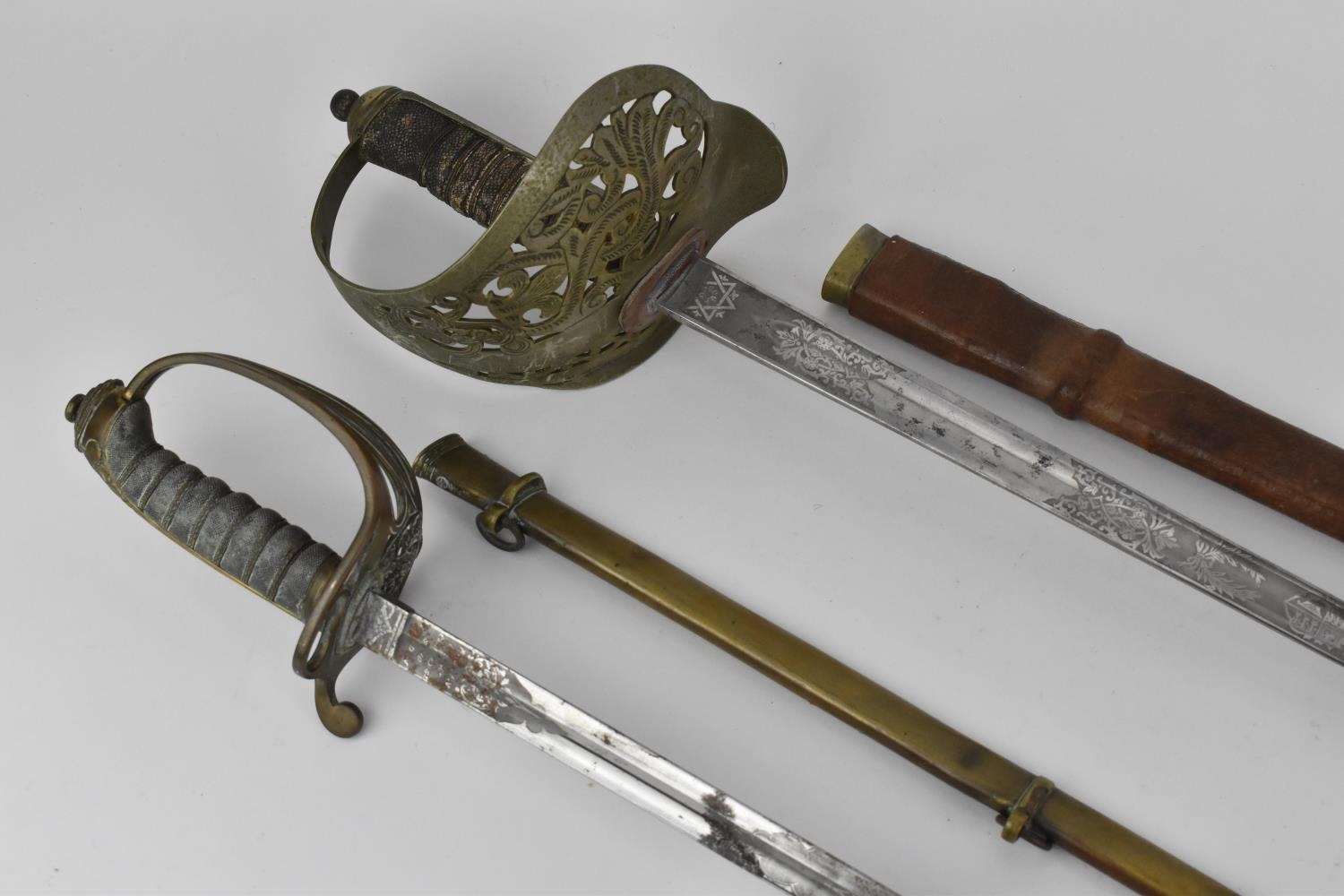 Two British army dress swords, one with leather scabbard, the grip with shagreen and large hoop - Image 9 of 15