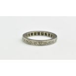 A white gold and diamond full eternity ring, the diamonds inter-set with beaded decoration, size Q