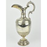 A late Victorian silver wine ewer by Samuel Smily, London 1876, modelled with ovoid body with