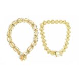 Two 9ct yellow gold bracelets to include one with heart shaped links with filigree detail, the other