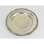 A mid 20th century Egyptian silver waiter, of circular form designed with moulded floral border, the