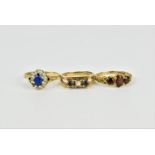 A group of three gem set 9ct gold rings, to include a cluster ring with central sapphire and white