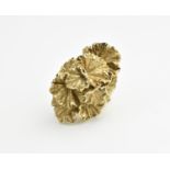 A 9ct yellow gold ladies dress ring with naturalistic cast foliage with thick shank, hallmarked to