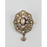 A Victorian/Edwardian rose cut diamond brooch, of oval form with central stone (not diamond)