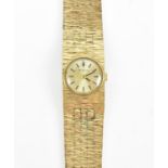 A 9ct yellow gold Bulova ladies cocktail wristwatch, with articulated textured strap, 16 cm long,