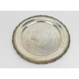 A mid 20th century Egyptian silver salver, of circular form designed with moulded floral border, the