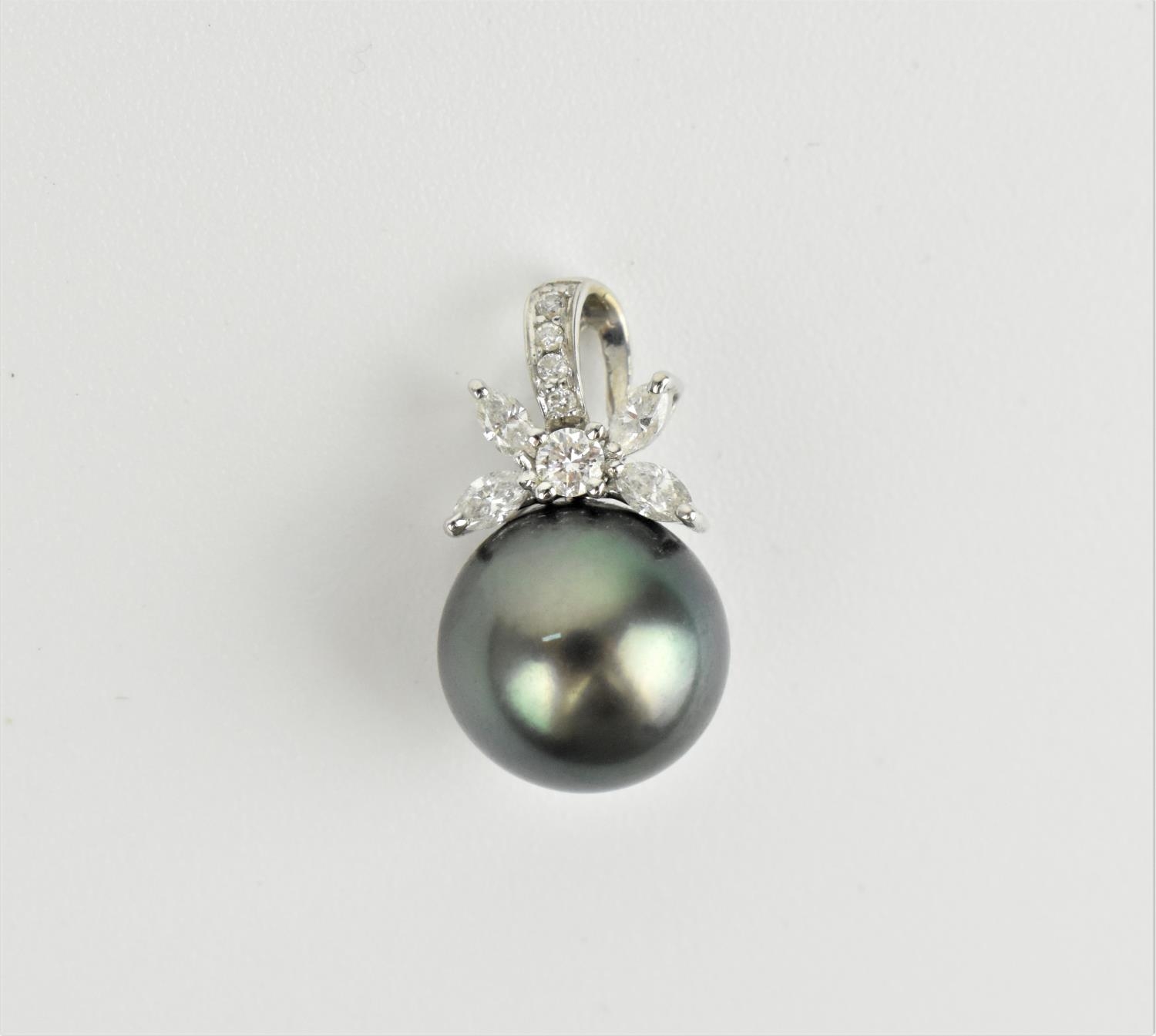 An 18ct white gold, diamond and Tahitian pearl pendant, the pearl surmounted with a diamond floral