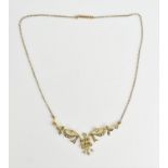 An Edwardian 9ct gold and seed pearl necklace, with dainty floral pendant inset with seed pearls