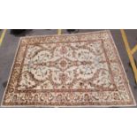 A large hand woven Ziegler design wool rug, with cream ground and meandering foliate design
