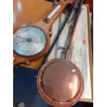 A Victorian copper warming pan, a rosewood cased wheel barometer, an ebonized cane with elephant's