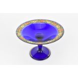 A Venetian Secessionist blue glass tazza, gilded edge boarder with a continuous band of orange and